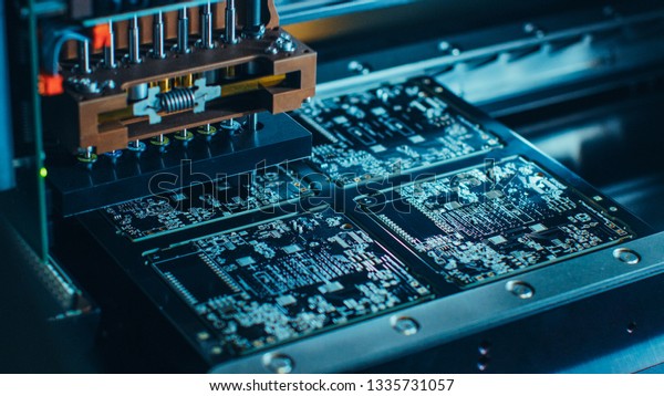 Close-up Macro Shot of Electronic Printed\
Circuit Board Being Assembled with Automated Robotic Arm, Surface\
Mounted Technology Connecting Microchips, Transistors, Capacitors\
to the Motherboard.
