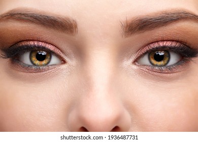 Closeup macro shot of human female face. Woman with natural face and eyes beauty makeup.