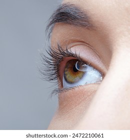 Closeup macro shot of human female eye. Woman with nude makeup of eyes or no visible makeup.