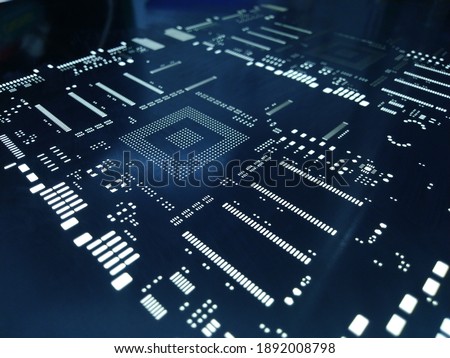 Close-up macro shot of a laser cut stainless steel stencil for solder paste application of printed circuit boards (PCB) for surface mounted (SMT) electronic components