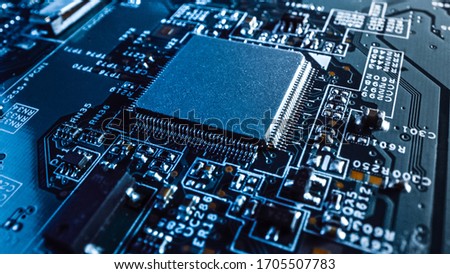 Close-up Macro Shot of a Microchip, CPU Processor with Printed Circuit Board / Computer Motherboard with Components: Inside of Electronic Device, Parts of Supercomputer.