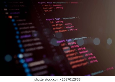 Close-up macro shot of TypeScript source code interface structure on a dark theme editor for software development, programming, and IT engineering projects.