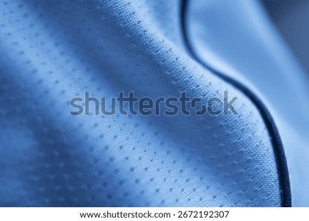 A close-up, macro shot of a white, high-performance technical fabric. 