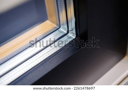 Close-up macro view of window frame made from PVC wooden profiles - double glazing