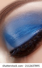 Closeup Macro Of Woman Face With Blue Eyes Make-up. Fashion Celebrate Makeup, Glowy Wet Eye Shadows And Black Eyelashes