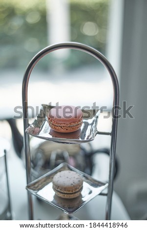 Closeup of magaron with tea set.(selective focus)
