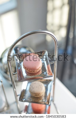 Closeup of magaron with tea set.(selective focus)
