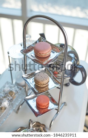 Closeup of magaron with tea set.(selective focus)
