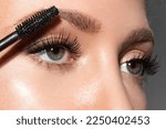 Close-up of make-up blue eye with long lashes with black mascara