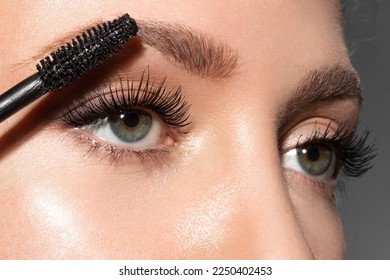 Close-up of make-up blue eye with long lashes with black mascara