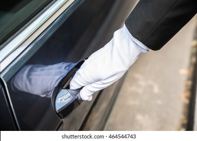 Close-up Of A Male Chauffeur Pulling A Car's Door Handle - Shutterstock ID 464544743