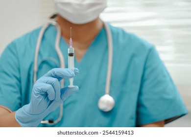 Close-up of A male doctor preparing a syringe in a modern clinic, focused and precise, with clean medical equipment surrounding him, representing professionalism and care. - Powered by Shutterstock