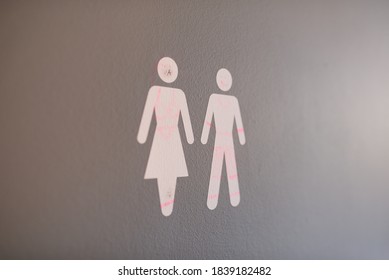 Closeup Of A Male And Female Bathroom Sign At A School