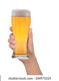 Closeup Of A Male Hand Holding Up A Glass Of Beer Over A White Background. Vertical Format With Condensation Side Of The Beer Glass.