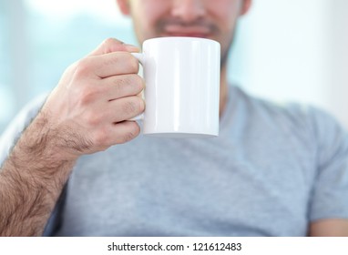 Close-up Of Male Hand Holding Mug