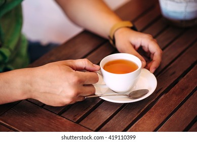 Close-up Male Hands Holding A Cup Of Tea