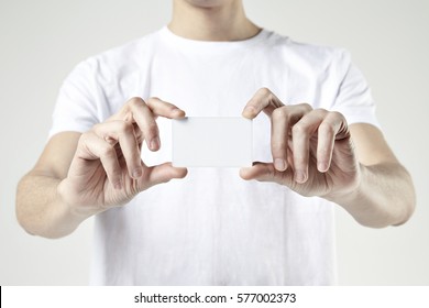 CLose-up Male Hands Holding Showing Plastic Card. Blank Space For Design Layout