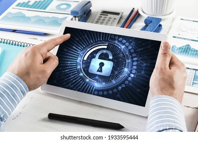 Close-up, Male Hands With Tablet. Businessman Working At The Table In Office. Computer Security Concept