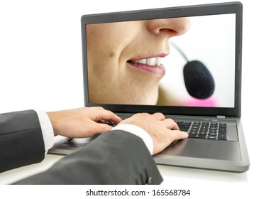 Closeup Of Male Hands Typing On Laptop Keyboard With Female Customer Service Representative On Its Screen.