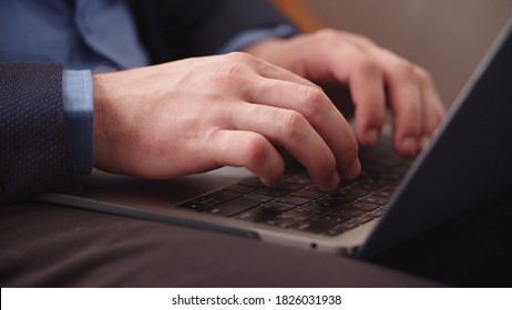 Closeup Male Hands Typing On Notebook Keyboard At Home Office. Close Up Business Man Working On Laptop In Remote Office. Successful Man Using Laptop Computer In Slow Motion.