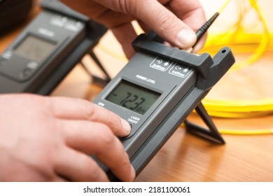 Close-up Male Hands Using Optical Tester