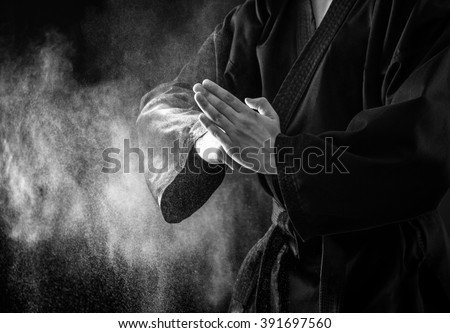 Closeup of male karate fighter hands. Black and white.