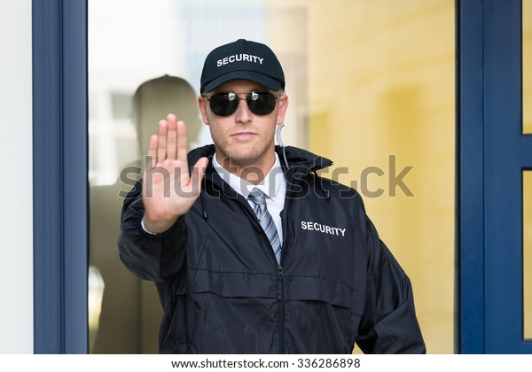 Closeup Male Security Guard Making Stop photo  de stock 