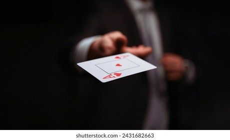 Close-up of male throwing trump out of sleeve. Professional player in presentable suit. Addiction gamers and risk. Strategy and business card game concept - Powered by Shutterstock