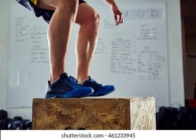 Closeup of man doing box jump exercise