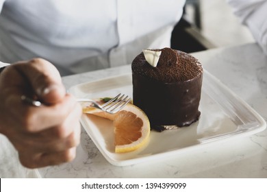 Closeup Of Man Eating Cake In A Cafe