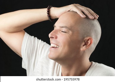 Close-up Of A Man Feeling His Newly Shaved Head.