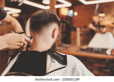 Closeup Man Haircut, Master Does Hair Styling In Barber Shop Back View. Barbershop Concept, Vintage Color.