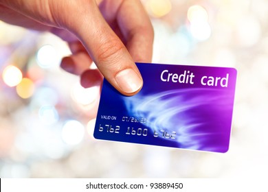 Close-up of man hand holding plastic credit card