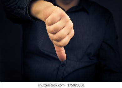 Closeup Of Man Hand Showing Thumbs Down