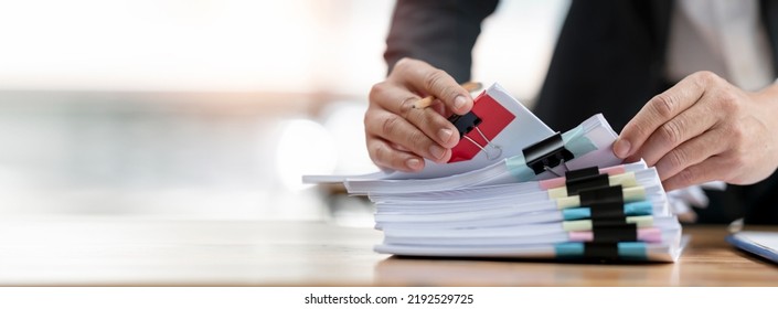 Closeup Man Hand Working On Stack Of Document Files, Work Form Home, Business Report. Banner Background.