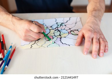 Close-up Of Man Hands Drawing Neurographic Art.  Mental Health, Adult Fine Motor Skill, Creativity, Psychology. Abstract Neurographic Drawing With Marker, Colored Pencils. Art Therapy. Selective Focus