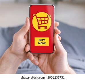 Closeup Of Man Hands Holding Smartphone With Shopping Application