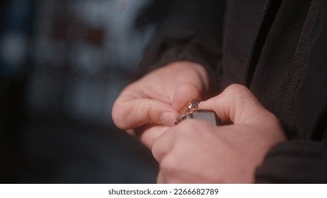 Close-Up of Man Hands Loading Ammunition into Magazine Clip