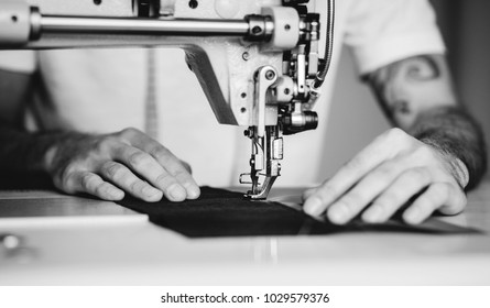 Close-up Man Hands Sewing Fabric On Sewing Machine