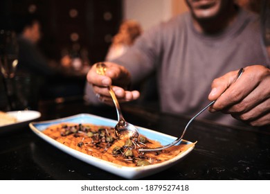 Close-up Of Man Having Dinner At Restaurant.