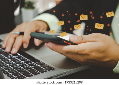 Close-up Man Holding A Cell Phone An Icon Email Message. Marketing Business Sending Information To Customers Or Hacking Online Transactions. Business Concept Technology.