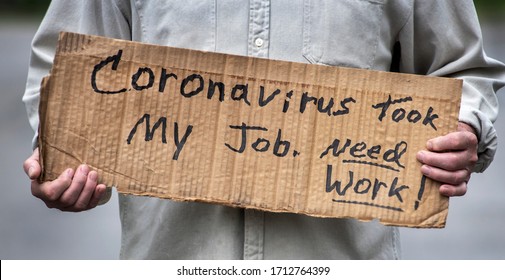 Closeup Man Holding Handwritten Cardboard Sign, Coronavirus Took My Job, Man's Hands, Unemployed, Downsized, Job, Employment, Job Loss, Fired, Discharged Worker, Pandemic, Job Market, Economy, Work