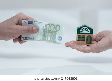 Close-up Of Man Holding Monthly House Fee