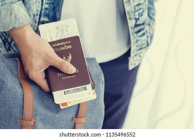 Closeup of Man holding passports and boarding pass,Business travel concept - Shutterstock ID 1135496552