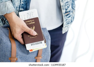 Closeup of Man holding passports and boarding pass,Business travel concept - Shutterstock ID 1139935187