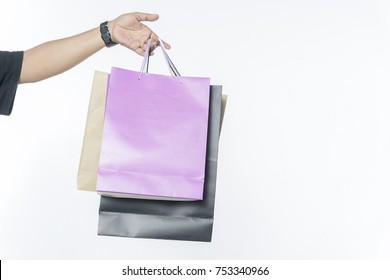 Closeup Of Man Holding Shopping Bags On White Background