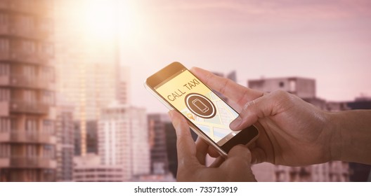 Close-up of man holding smart phone against skyscrapers in city against sky - Shutterstock ID 733713919