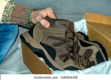 Closeup Man Holds Boot Hand Male Stock Photo (Edit Now) 1583036338