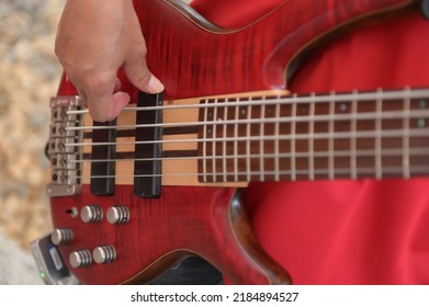 Close-up Of A Man Playing A Red Guitar Stock Picture