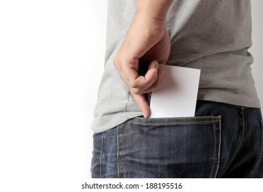 Closeup Man Pulling A Card On His Back Pocket, Blank Card With Copy Space In A Pocket Of Jeans.